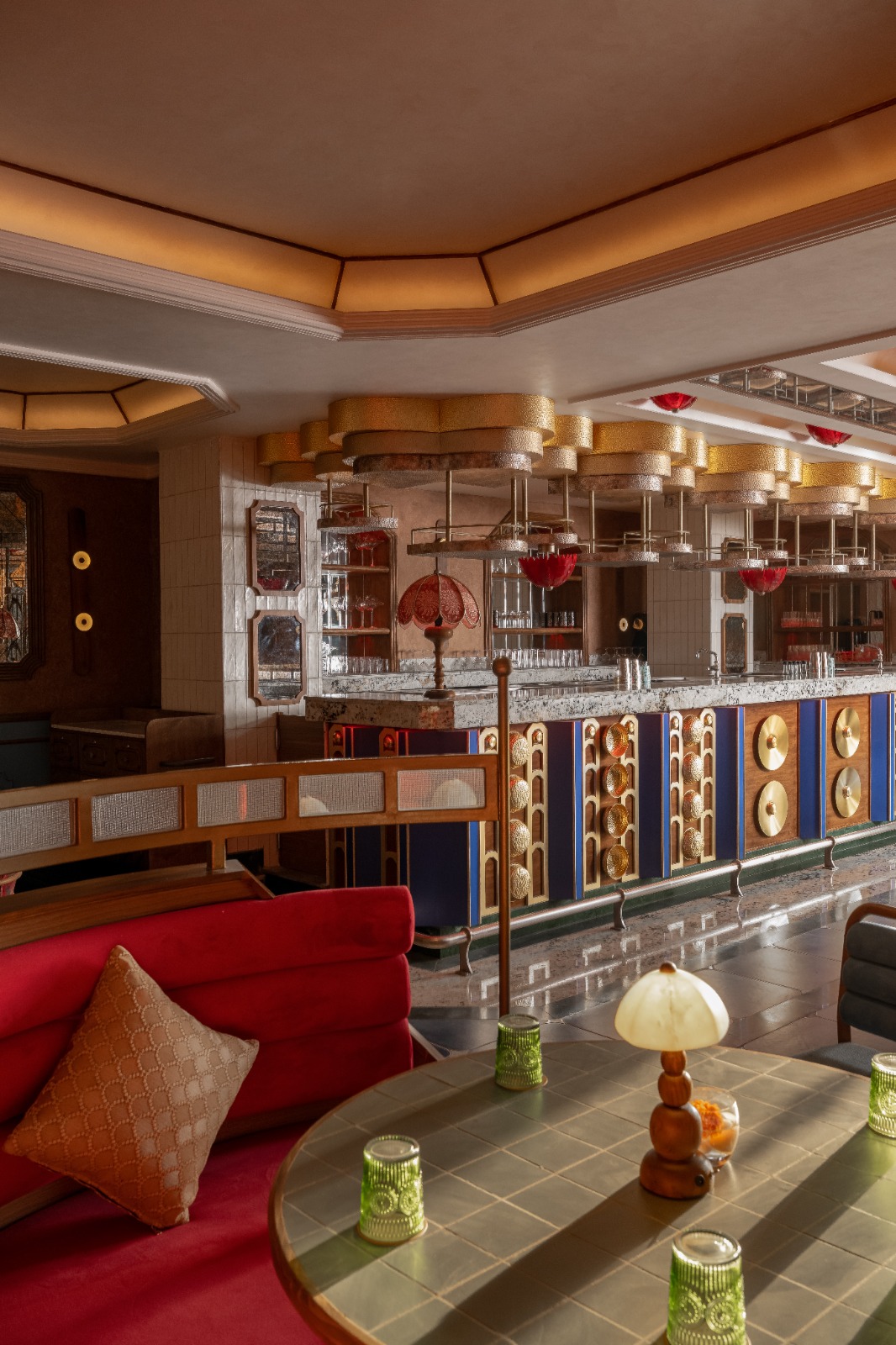 Bar detail at Goonj — brass and warm light